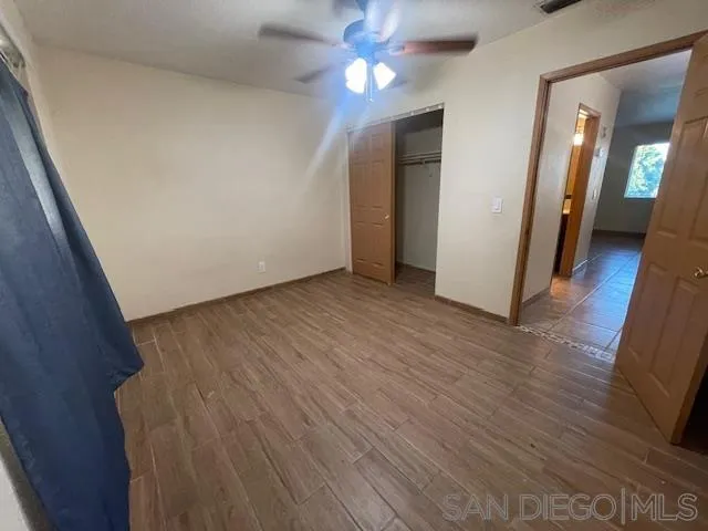 155 G Street Brawley, CA 92227 - Photo 4 of 11 a view of a hallway with wooden floor