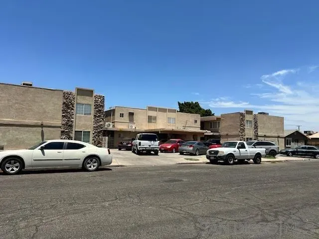 a view of cars parked in front of a building
