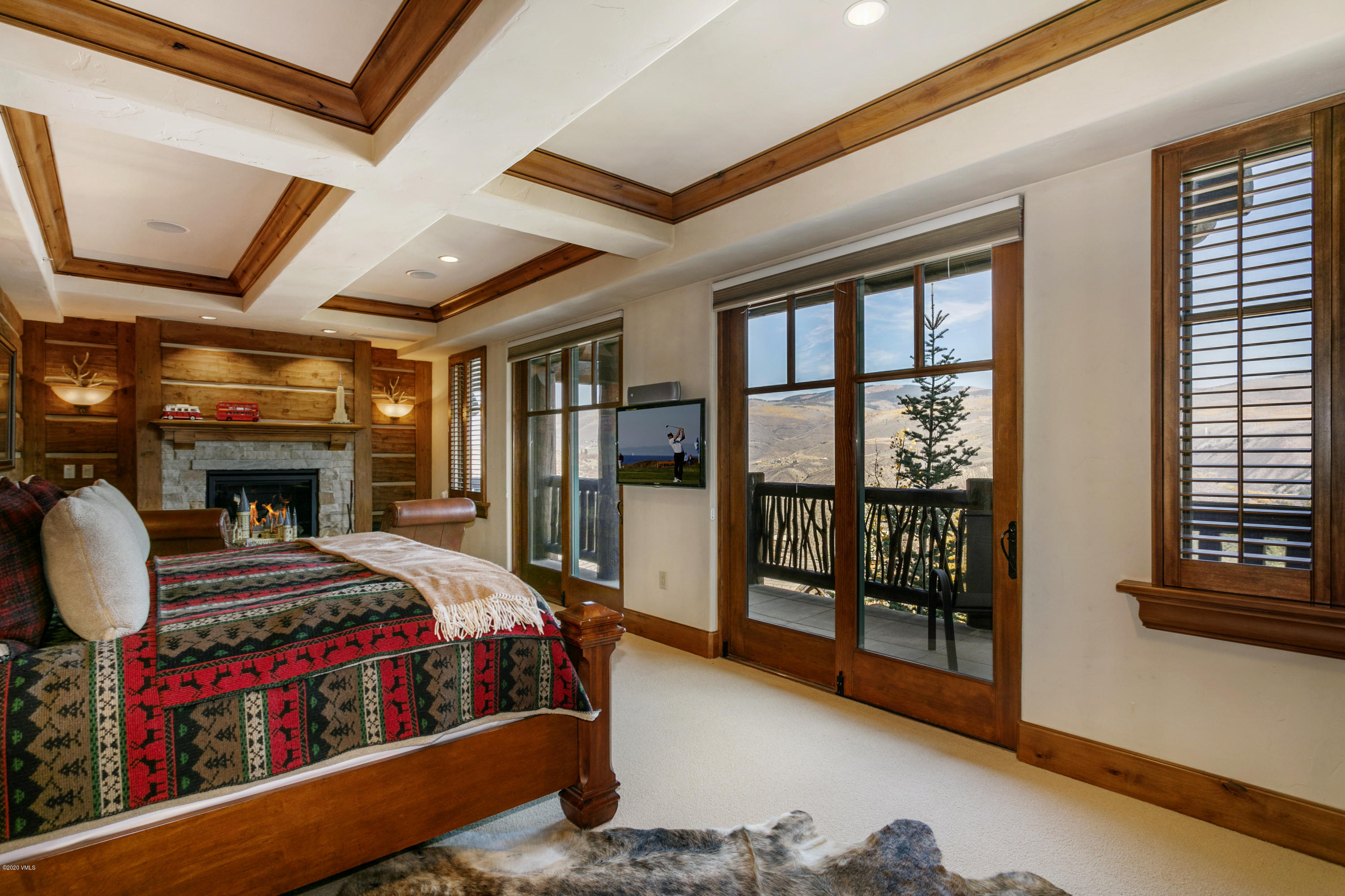 130 Daybreak Ridge Road, Unit R906 Avon, CO 81620 - Photo 14 of 26 a bedroom with furniture and a window