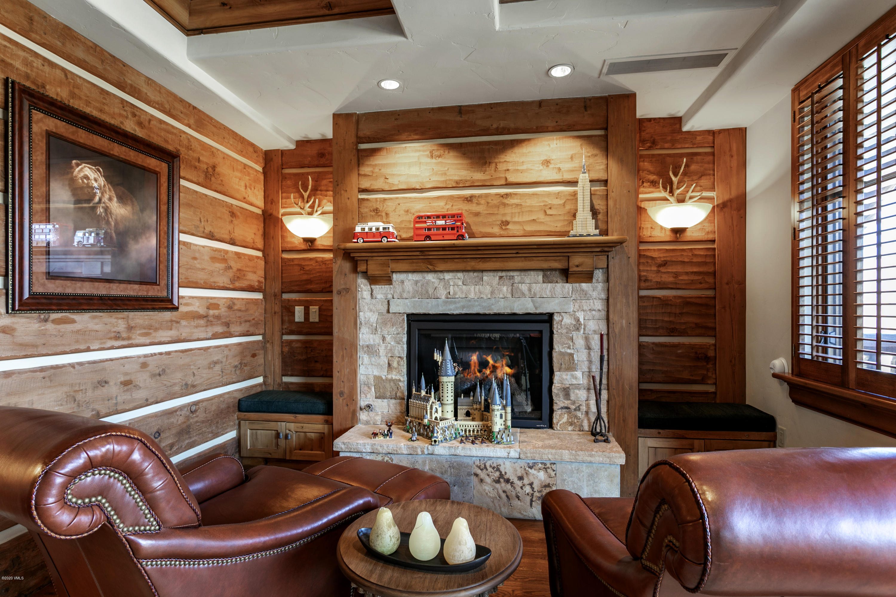 130 Daybreak Ridge Road, Unit R906 Avon, CO 81620 - Photo 15 of 26 a living room with furniture and a fireplace
