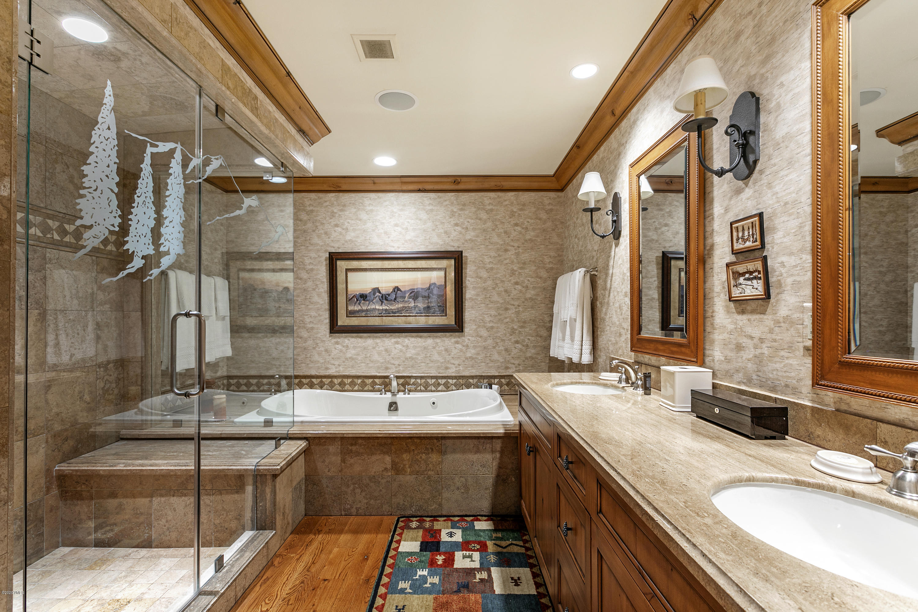 130 Daybreak Ridge Road, Unit R906 Avon, CO 81620 - Photo 16 of 26 a bathroom with a sink double vanity granite tub shower and mirror