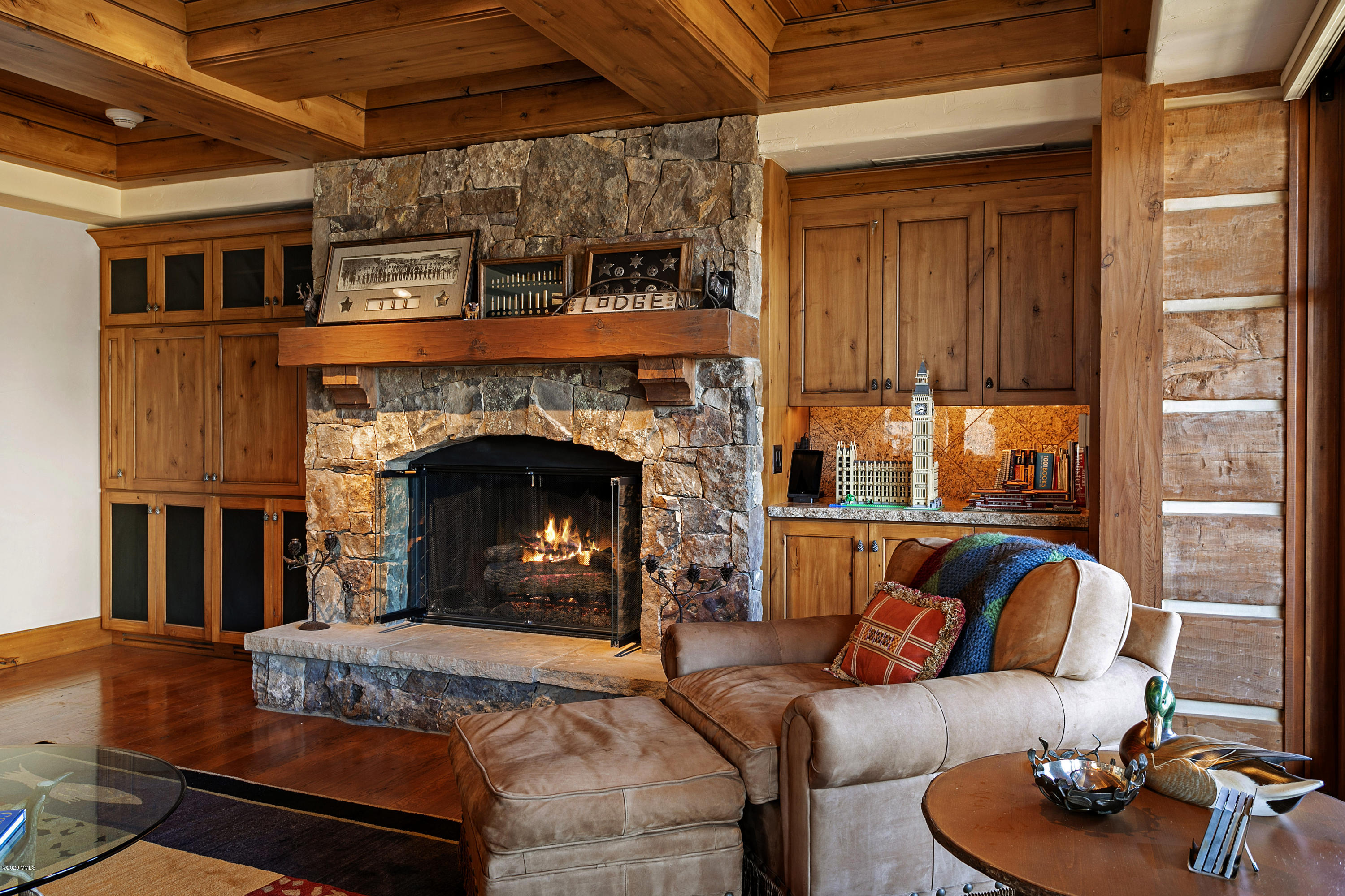 130 Daybreak Ridge Road, Unit R906 Avon, CO 81620 - Photo 2 of 26 a living room with furniture and a fireplace