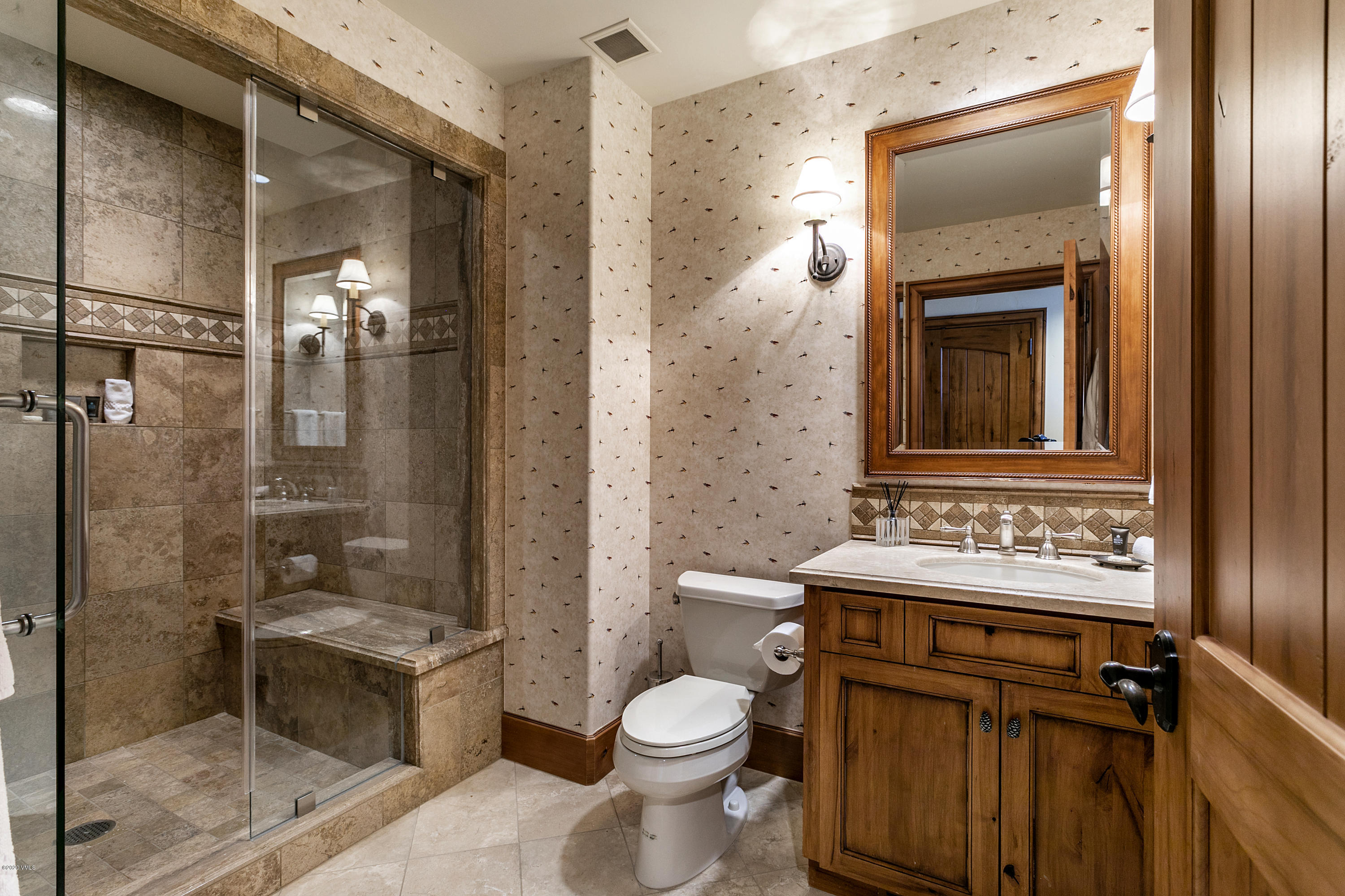 130 Daybreak Ridge Road, Unit R906 Avon, CO 81620 - Photo 21 of 26 a bathroom with a sink toilet and shower
