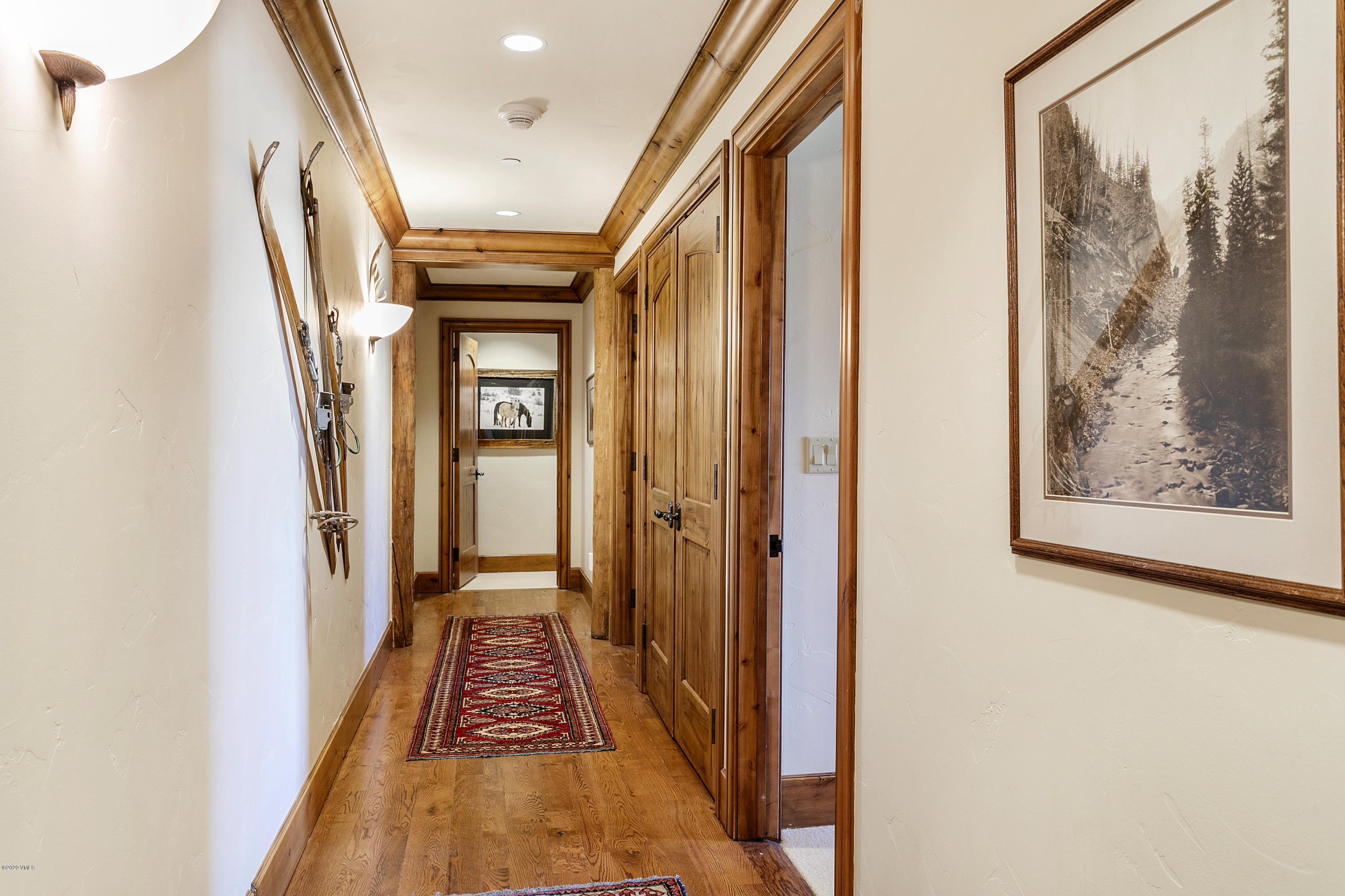130 Daybreak Ridge Road, Unit R906 Avon, CO 81620 - Photo 22 of 26 a view of hallway with wooden floor and stairs