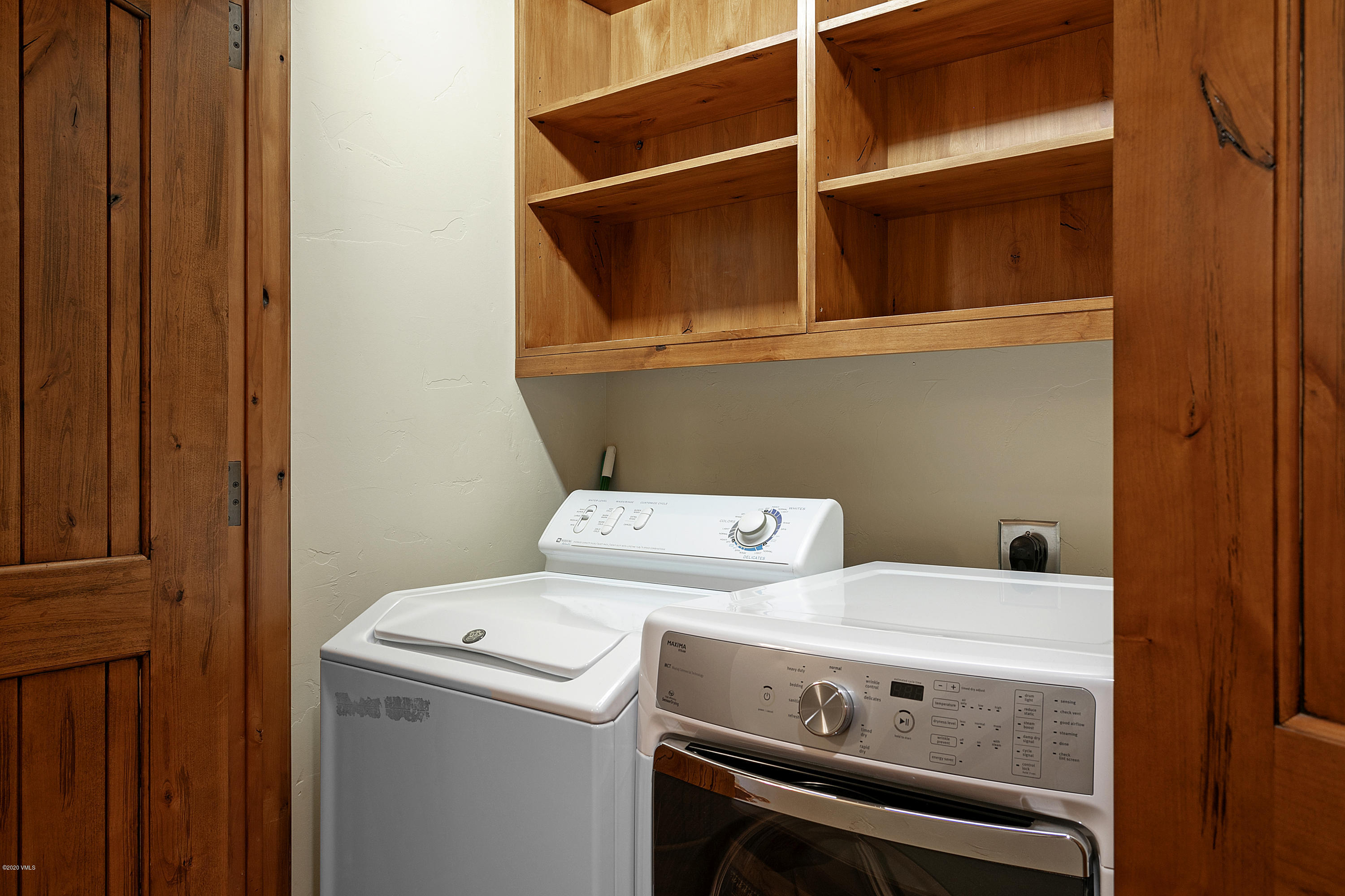 130 Daybreak Ridge Road, Unit R906 Avon, CO 81620 - Photo 23 of 26 a utility room with dryer and washer