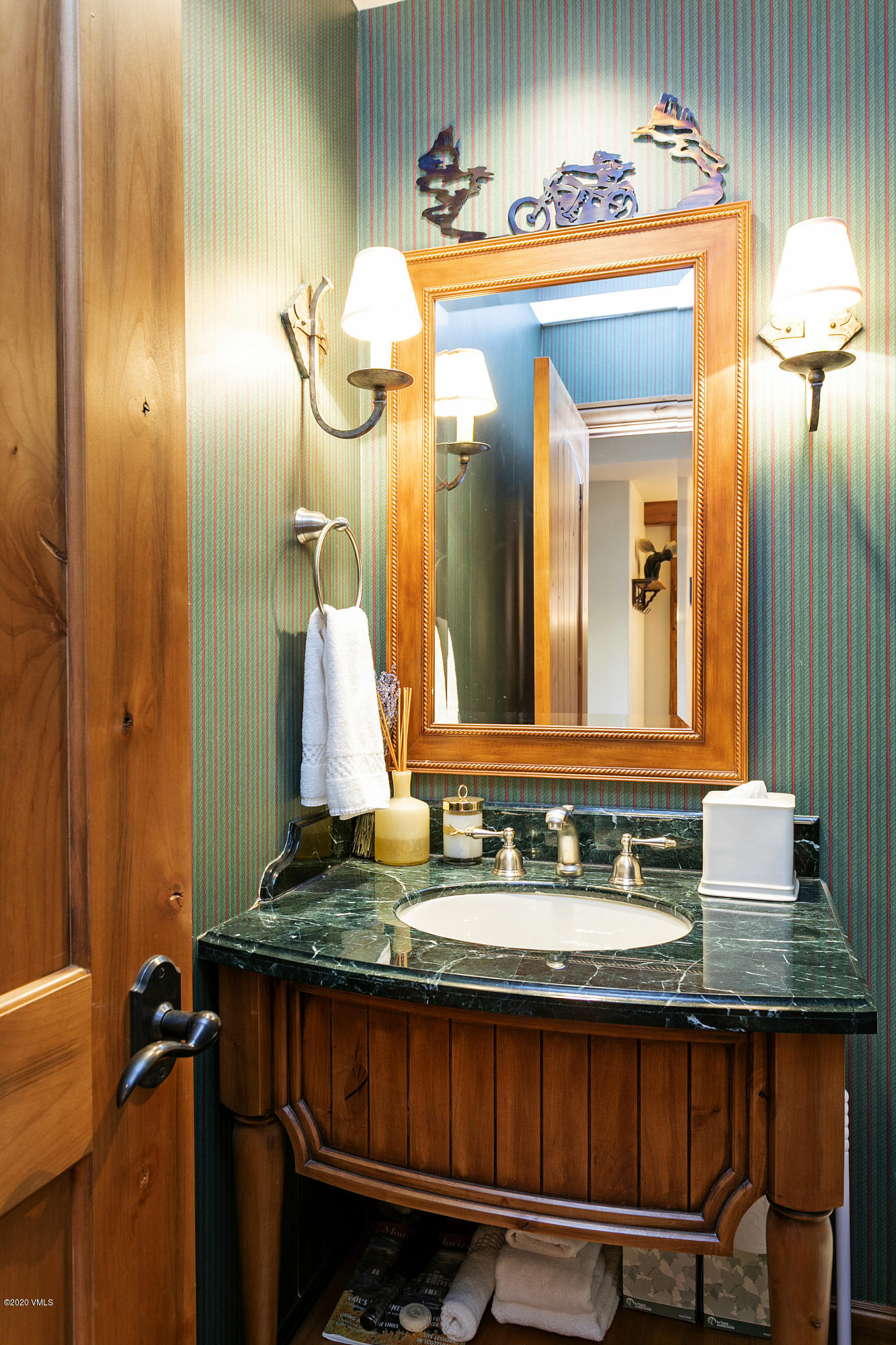 130 Daybreak Ridge Road, Unit R906 Avon, CO 81620 - Photo 24 of 26 a bathroom with a sink and a mirror
