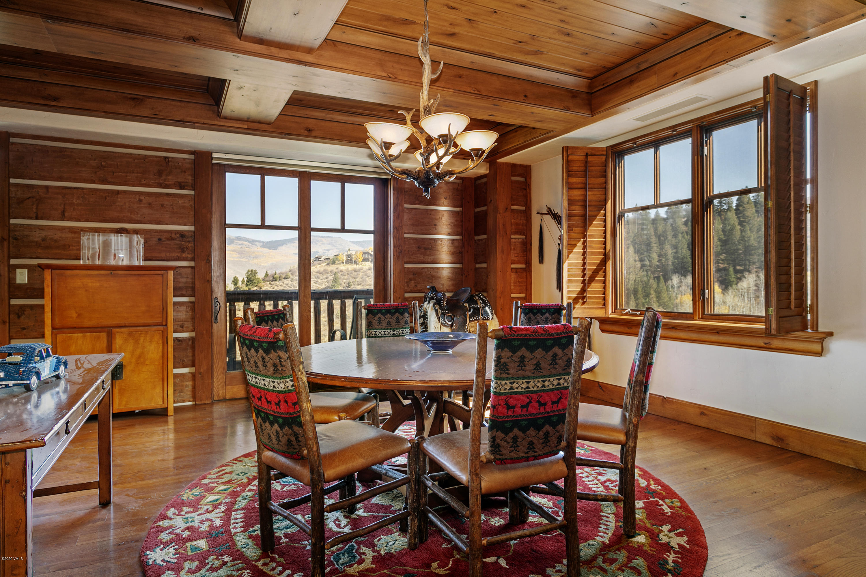 130 Daybreak Ridge Road, Unit R906 Avon, CO 81620 - Photo 4 of 26 a view of a dining room with furniture window and outside view