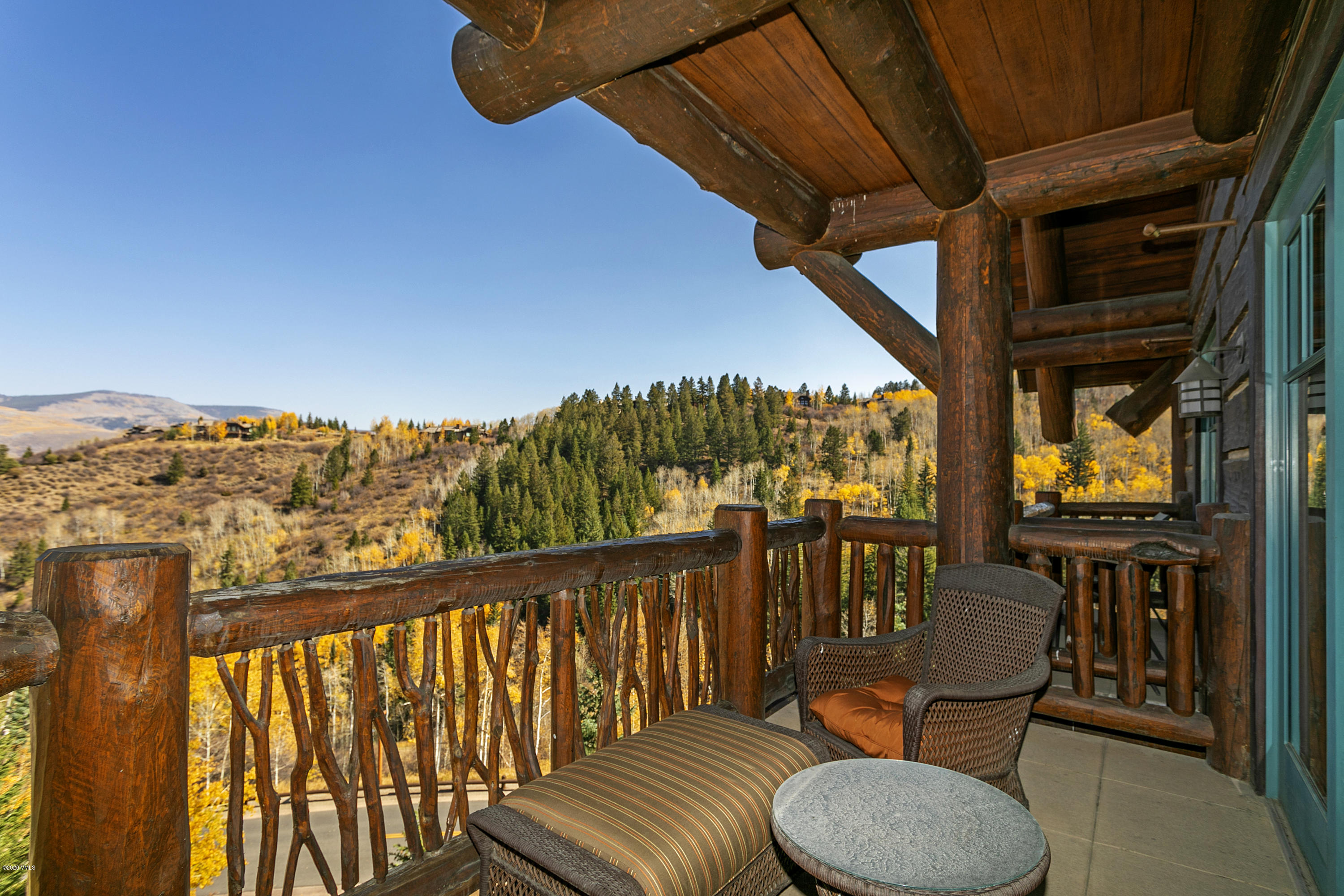 130 Daybreak Ridge Road, Unit R906 Avon, CO 81620 - Photo 8 of 26 a view of a chairs and table in the balcony