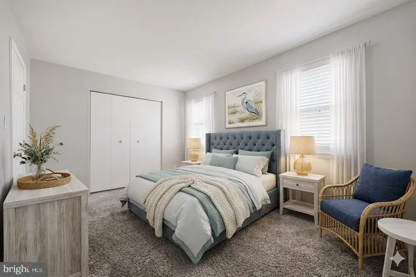 a bedroom with a bed and a couch