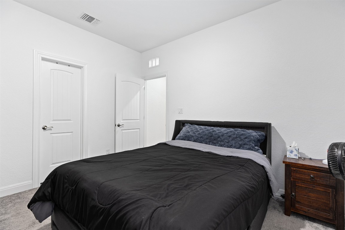 116 Raleigh Drive Georgetown, TX 78633 - Photo 15 of 24 a bedroom with a bed and cabinets
