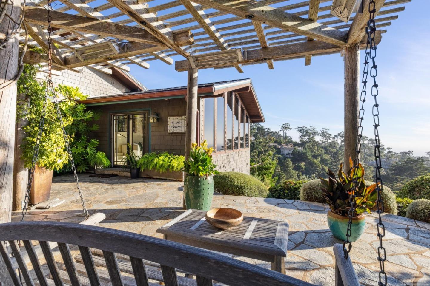139 Boyd Way Carmel, CA 93923 - Photo 16 of 65 a view of a patio with table and chairs and potted plants