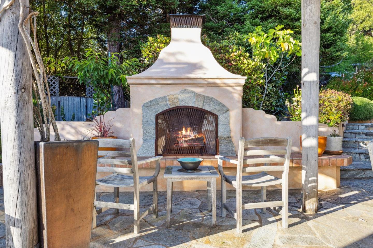 139 Boyd Way Carmel, CA 93923 - Photo 18 of 65 a view of a patio with table and chairs and a fireplace