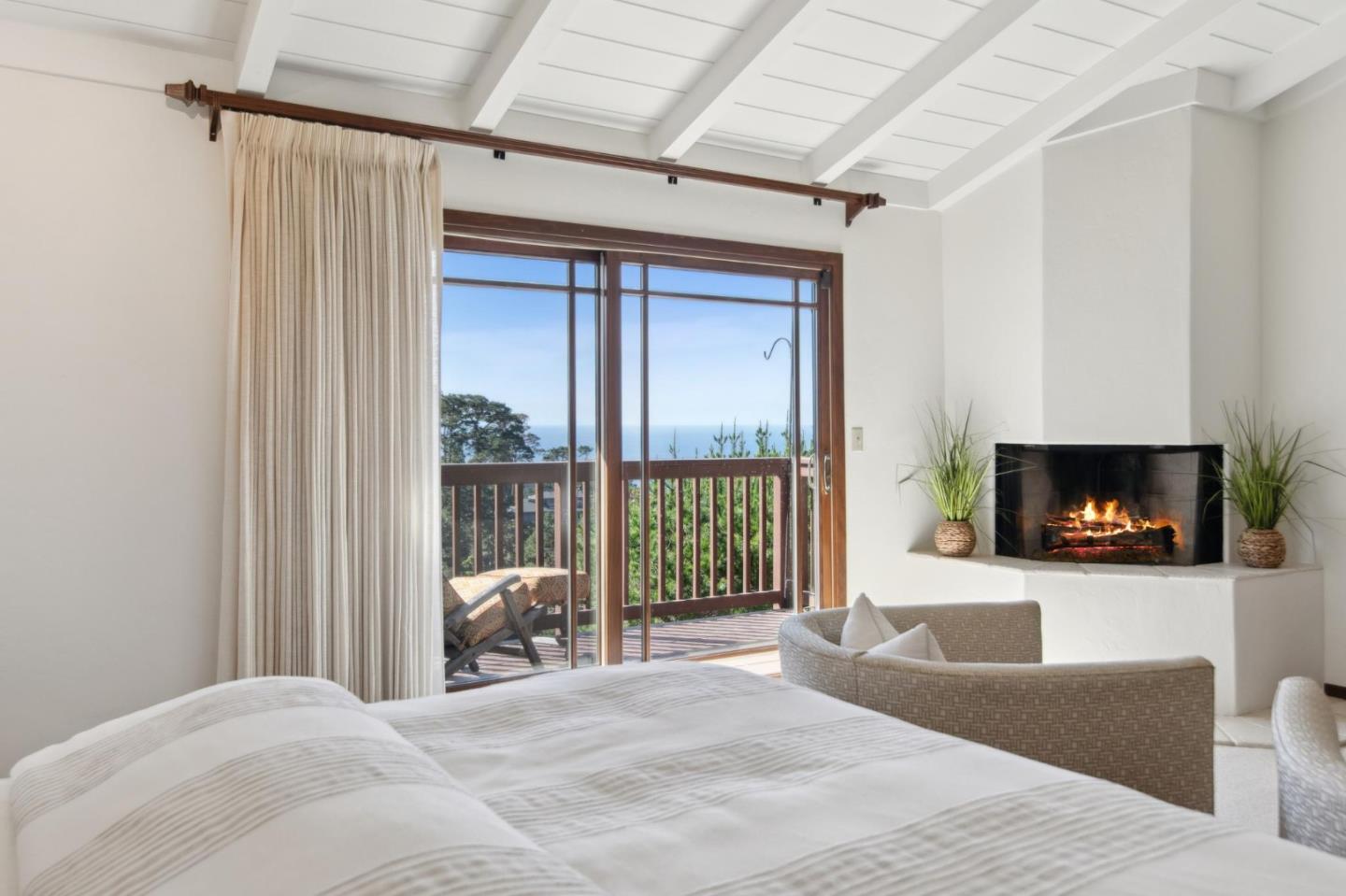 139 Boyd Way Carmel, CA 93923 - Photo 35 of 65 a bedroom with a bed and a fireplace