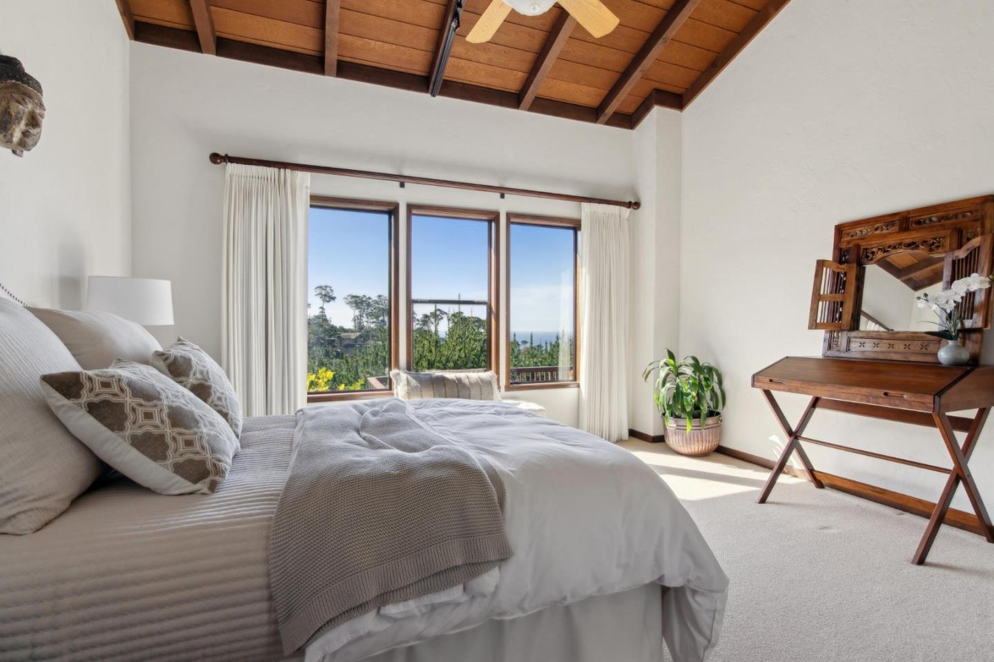 139 Boyd Way Carmel, CA 93923 - Photo 41 of 65 a bed sitting in a bedroom next to a window