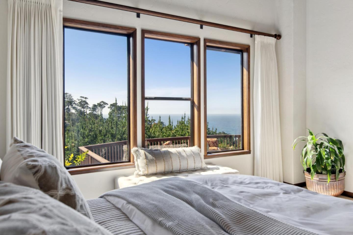 139 Boyd Way Carmel, CA 93923 - Photo 42 of 65 a living room with a bed and a large window with garden view