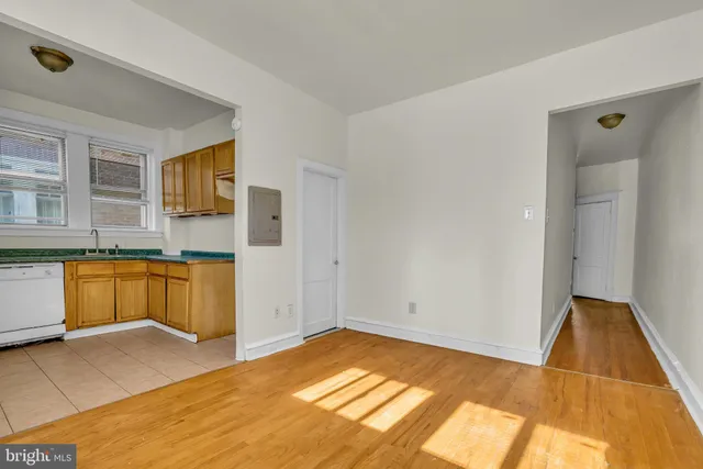 a view of a kitchen with a sink and a dishwasher