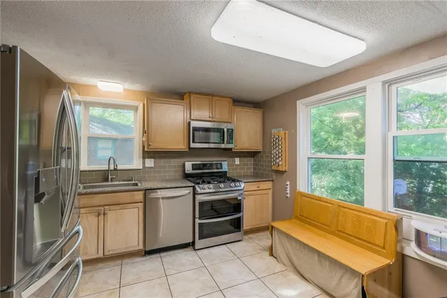 $335,000 | 6607 Northwest Quail Run Drive, Kansas City, MO 64152