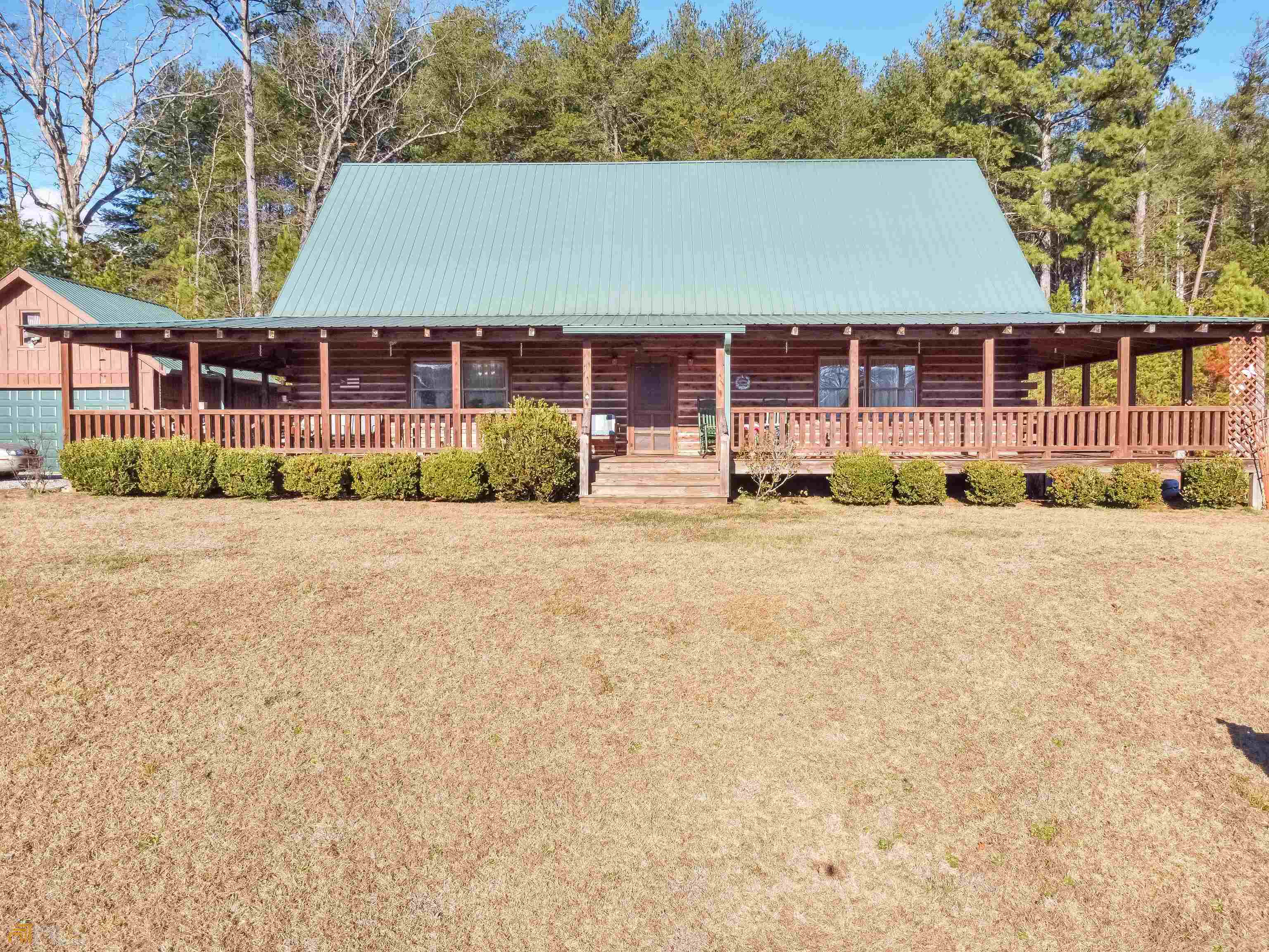 4576 Duncan Bridge Road Southwest Cornelia, GA 30531 - Photo 1 of 1 a front view of a house with a yard and garage