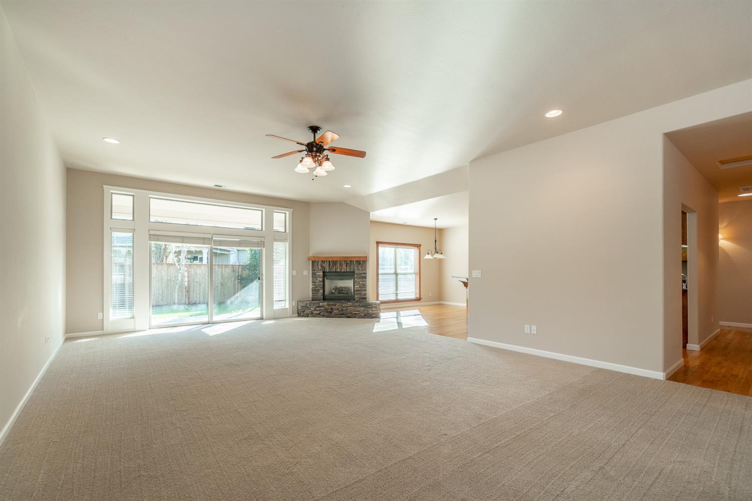 946 Pumpkin Ridge Eagle Point, OR 97524 - Photo 6 of 31 a view of an empty room with a fireplace