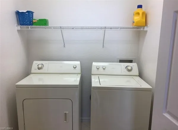 a utility room with dryer and washer
