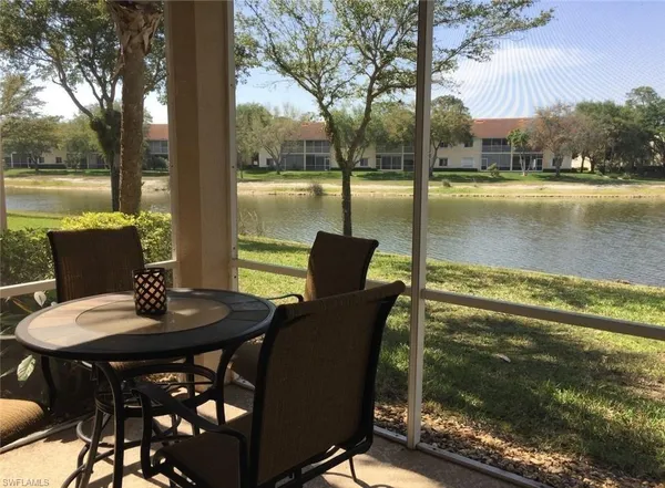 a balcony view with a seating space