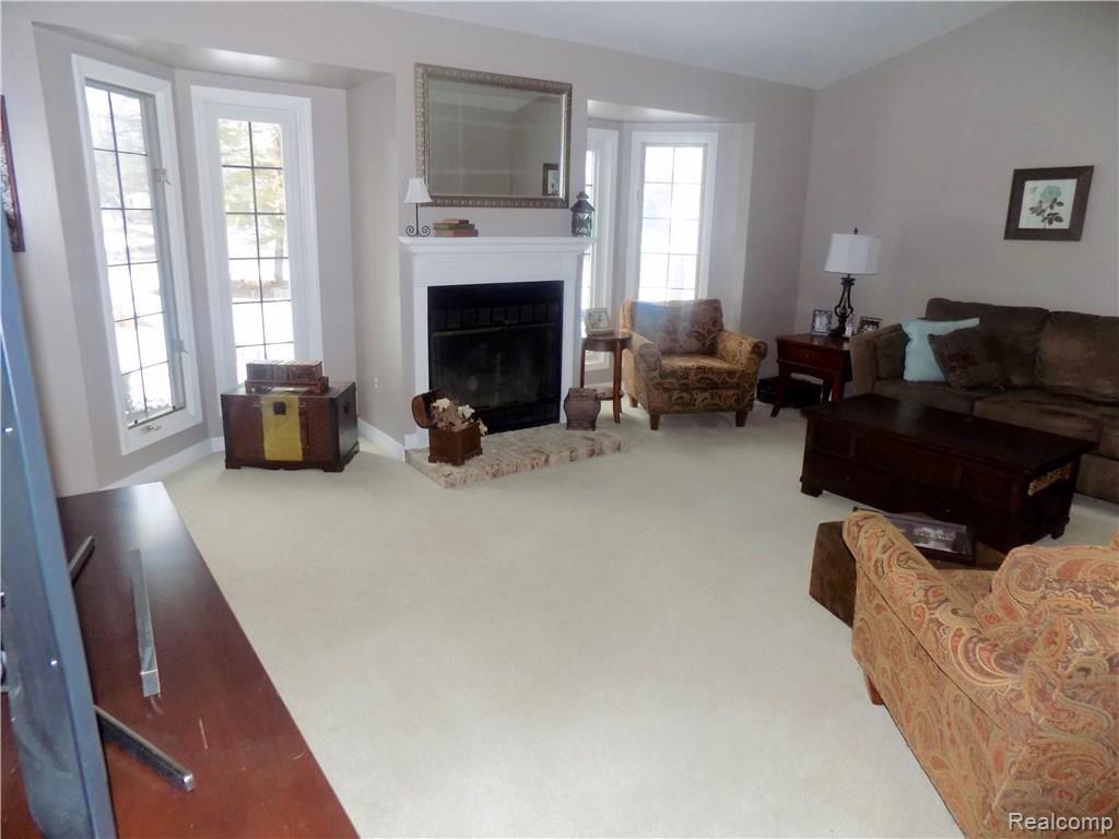 1905 Medler Road Commerce Township, MI 48382 - Photo 2 of 34 LIVING ROOM - LOTS OF NATURAL LIGHT - GAS FIREPLACE!