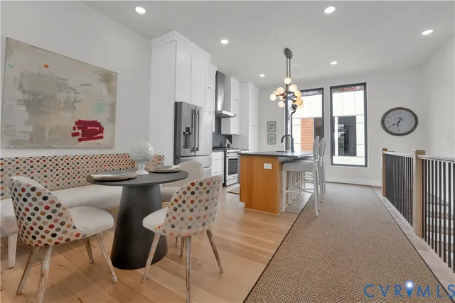 a living room with furniture a dining table and chairs