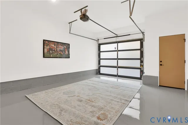 a view of a room with wooden floor and windows