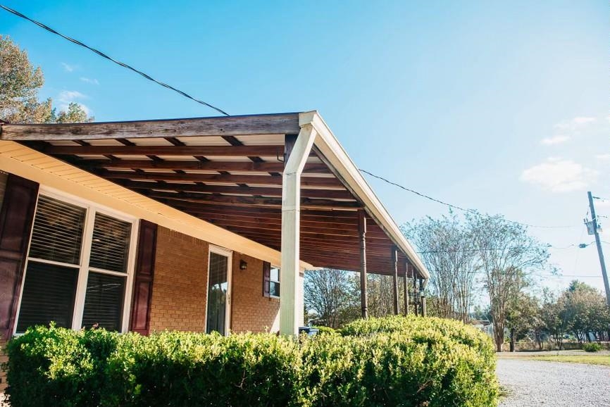457 Maple Circle Hickory Flat, MS 38633 - Photo 16 of 24 a view of a house with a small yard and potted plants