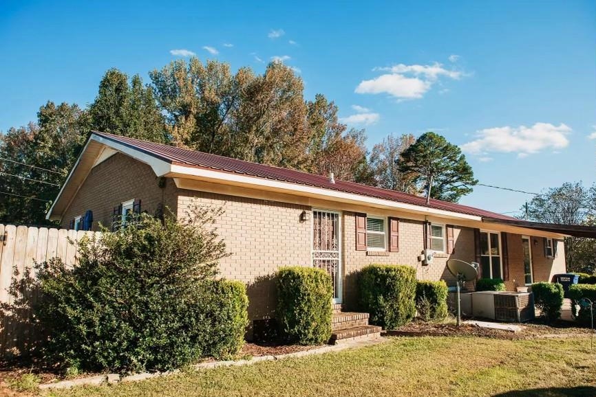 457 Maple Circle Hickory Flat, MS 38633 - Photo 17 of 24 a front view of a house with garden