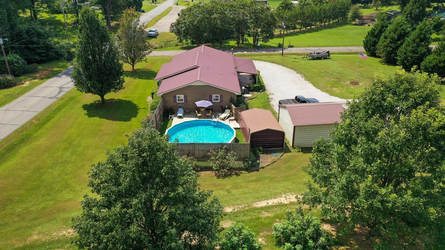 457 Maple Circle Hickory Flat, MS 38633 - Photo 2 of 24 a view of a house with a yard and a pool