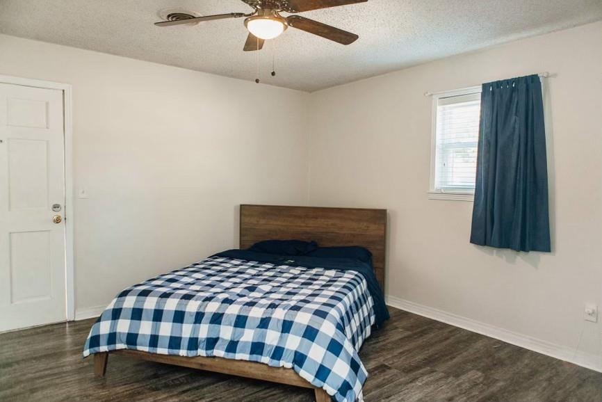 457 Maple Circle Hickory Flat, MS 38633 - Photo 8 of 24 a bedroom with a bed and a window