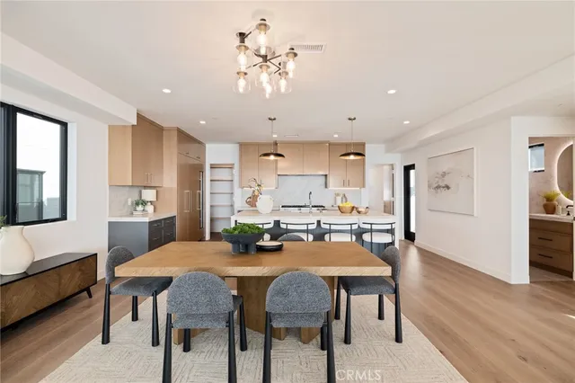 a kitchen with granite countertop stainless steel appliances and white cabinets