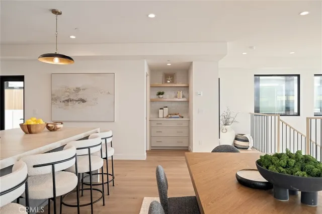 a bathroom with a sink mirror and toilet