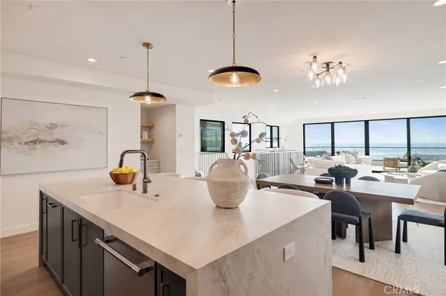 a large kitchen with a table and chairs