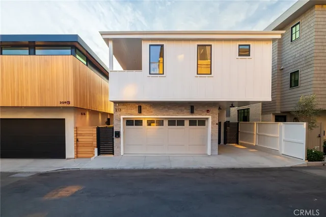 a front view of a house with a garage