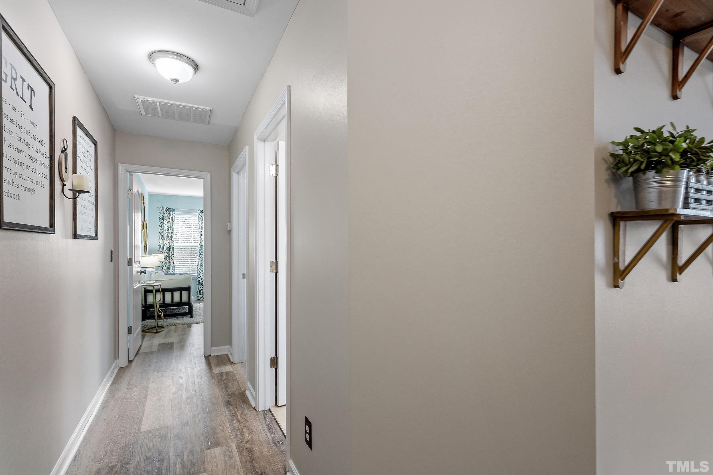 2463 Memory Ridge Drive Raleigh, NC 27606 - Photo 24 of 34 a view of a hallway to a livingroom and furniture