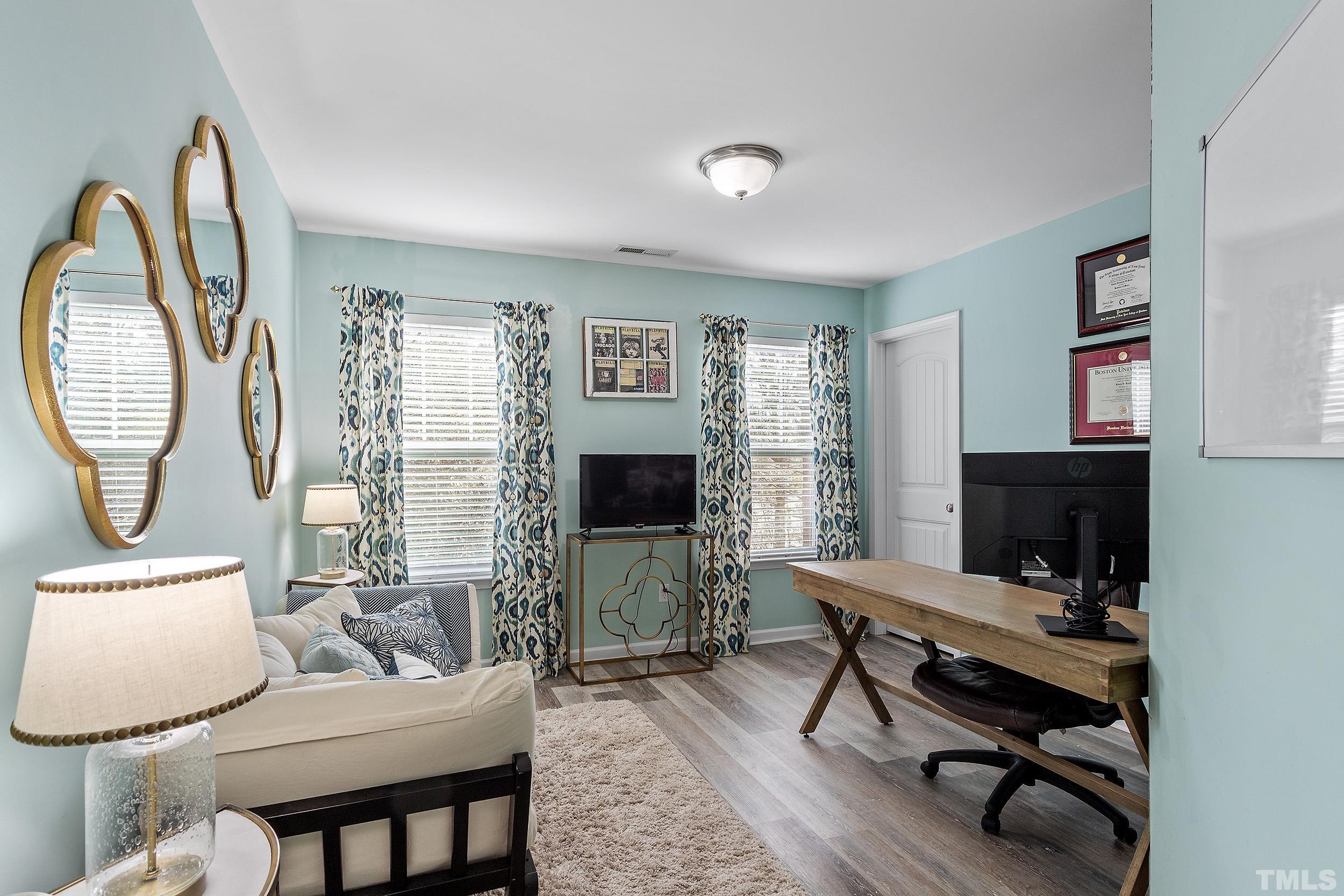 2463 Memory Ridge Drive Raleigh, NC 27606 - Photo 26 of 34 a living room with furniture a rug and a window