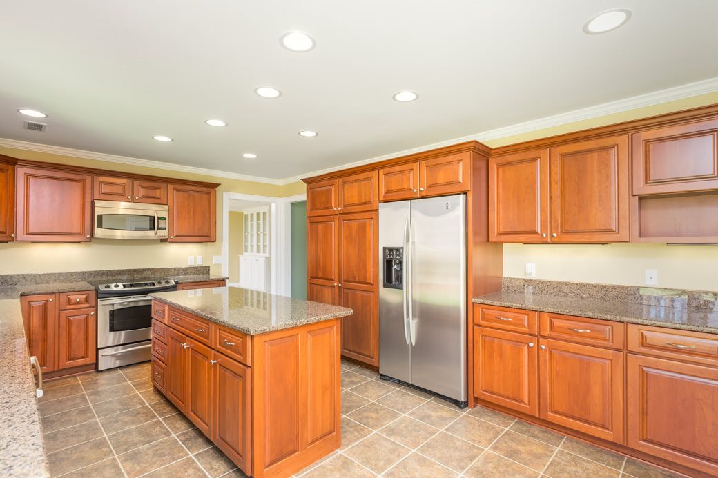 3120 Mt Vernon Church Road Raleigh, NC 27613 - Photo 1 of 9 The open kitchen offers GRANITE counters, STAINLESS STEEL appliances, breakfast nook, and CUSTOM CABINETS with PULL OUT DRAWERS. Expansive kitchen offers plenty of storage and large ISLAND provides tons of prep space. Ktichen