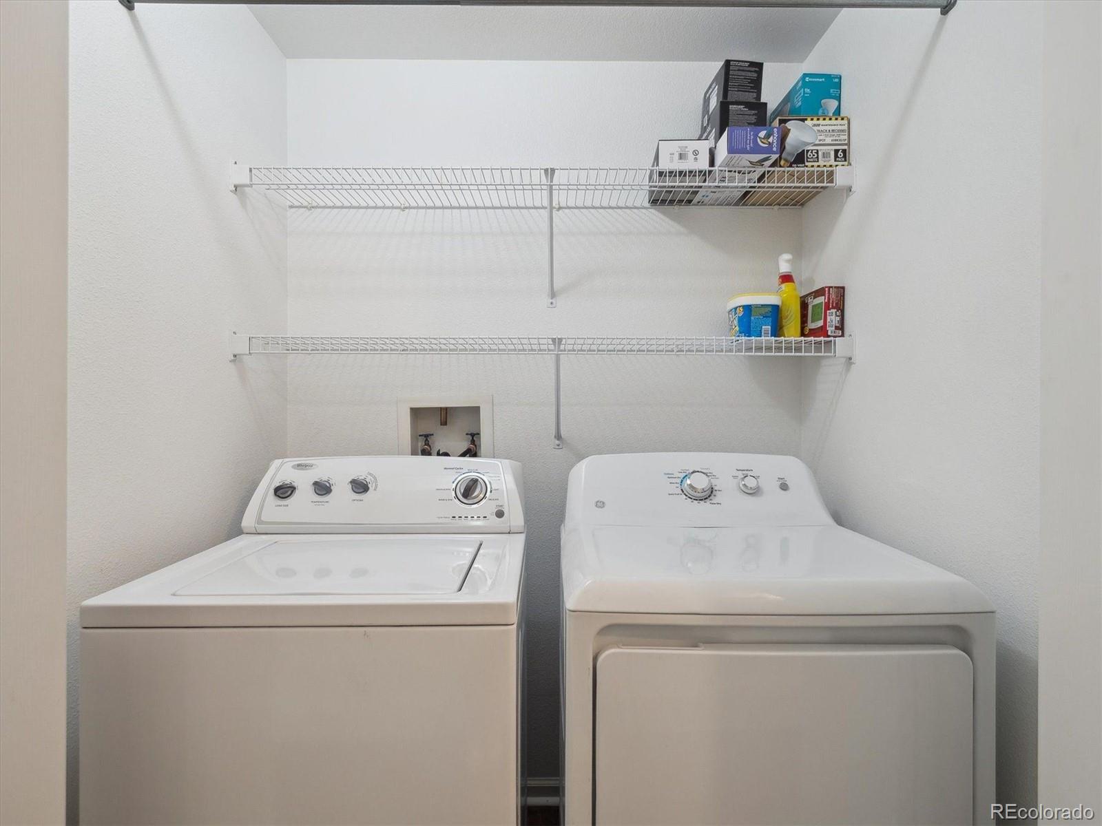 3855 East Canyon Ranch Road, Unit 104 Highlands Ranch, CO 80126 - Photo 17 of 18 a utility room with dryer and washer