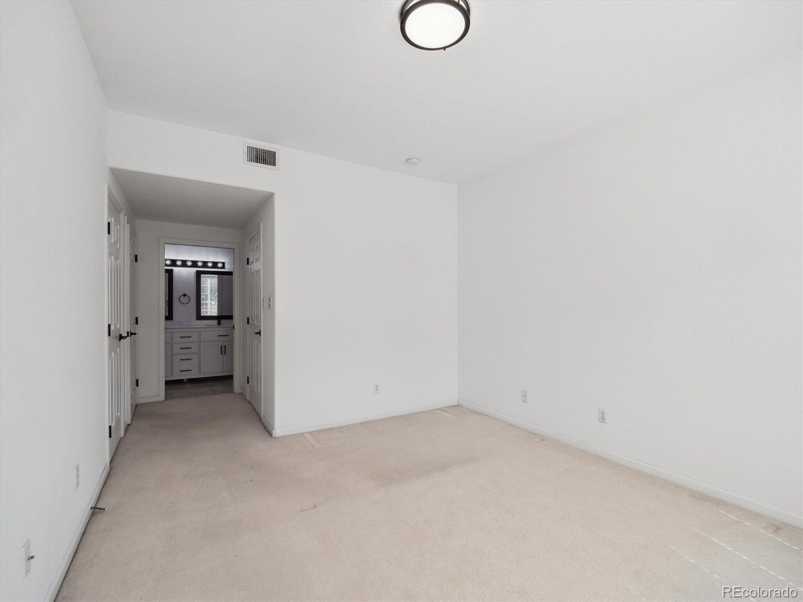 3855 East Canyon Ranch Road, Unit 104 Highlands Ranch, CO 80126 - Photo 9 of 18 a view of a room with wooden floor