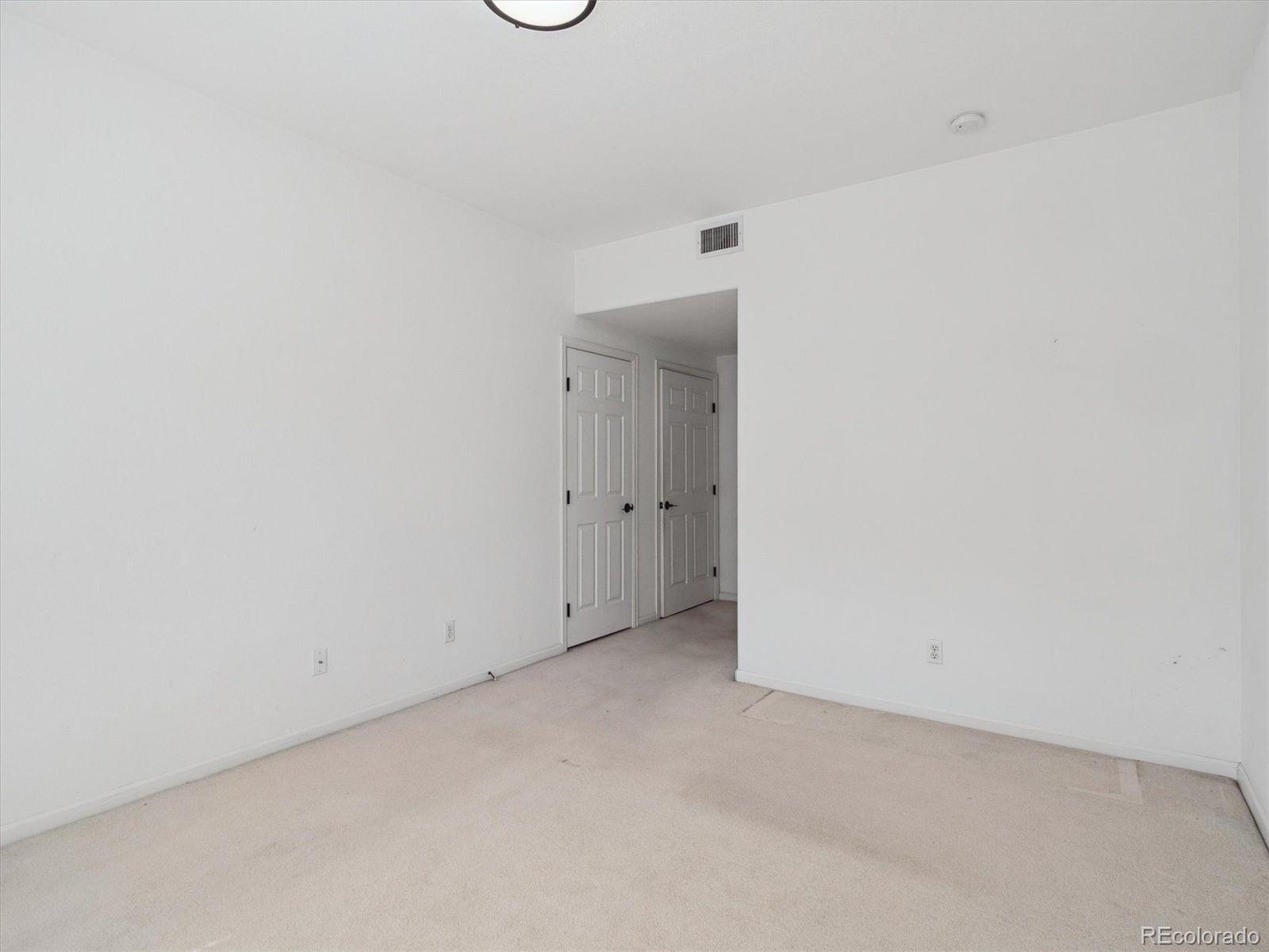 3855 East Canyon Ranch Road, Unit 104 Highlands Ranch, CO 80126 - Photo 10 of 18 a view of an empty room