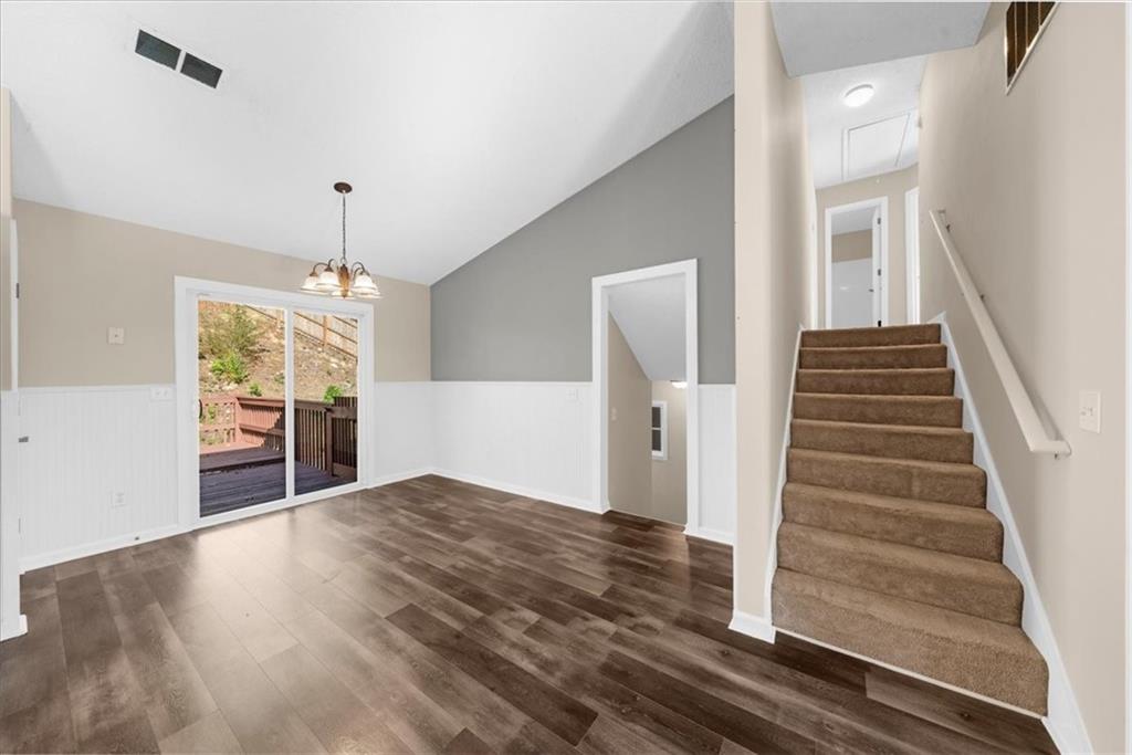 203 Bainbridge Way Dallas, GA 30132 - Photo 15 of 38 wooden floor in an empty room with a window
