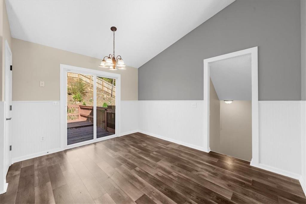 203 Bainbridge Way Dallas, GA 30132 - Photo 16 of 38 wooden floor in an empty room with a window