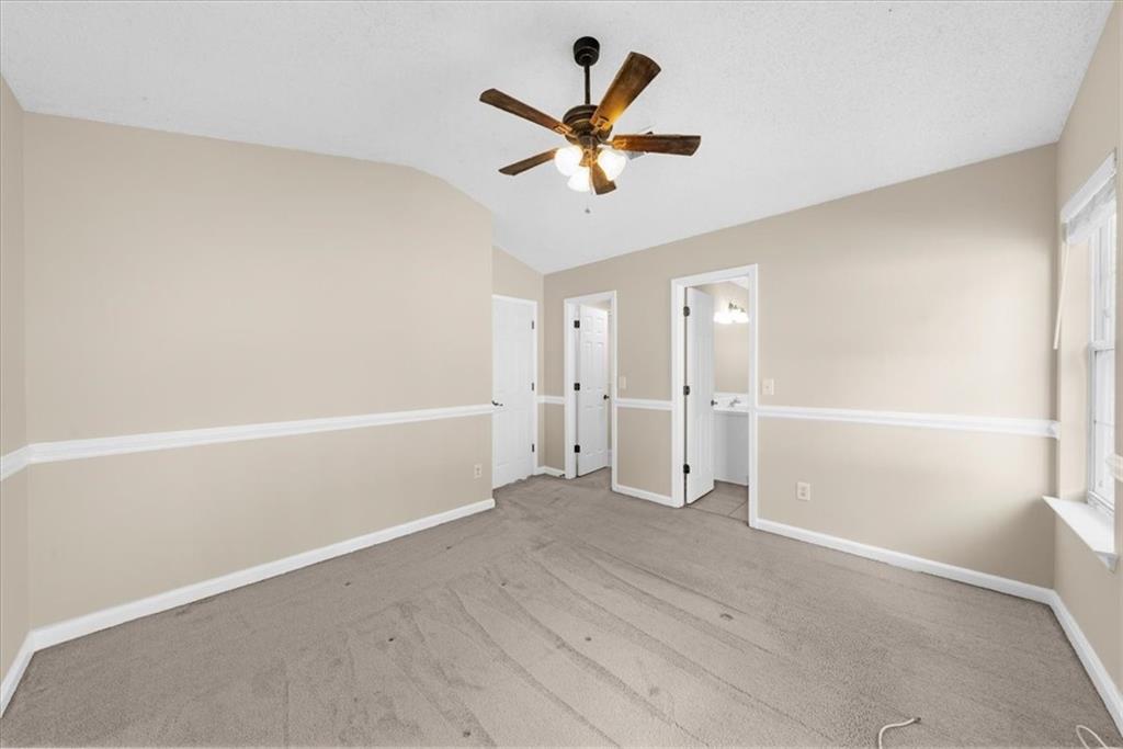 203 Bainbridge Way Dallas, GA 30132 - Photo 19 of 38 an empty room with closet and windows