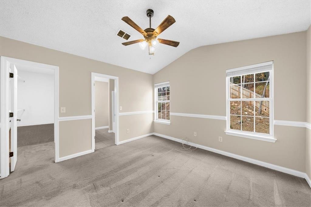203 Bainbridge Way Dallas, GA 30132 - Photo 20 of 38 an empty room with closet and windows