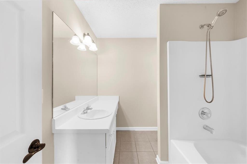 203 Bainbridge Way Dallas, GA 30132 - Photo 21 of 38 a bathroom with a bath tub and shower