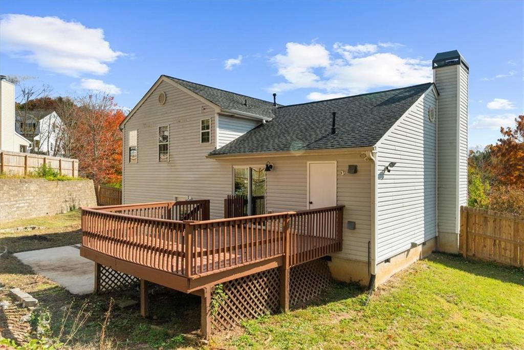 203 Bainbridge Way Dallas, GA 30132 - Photo 29 of 38 a view of a house with a wooden deck