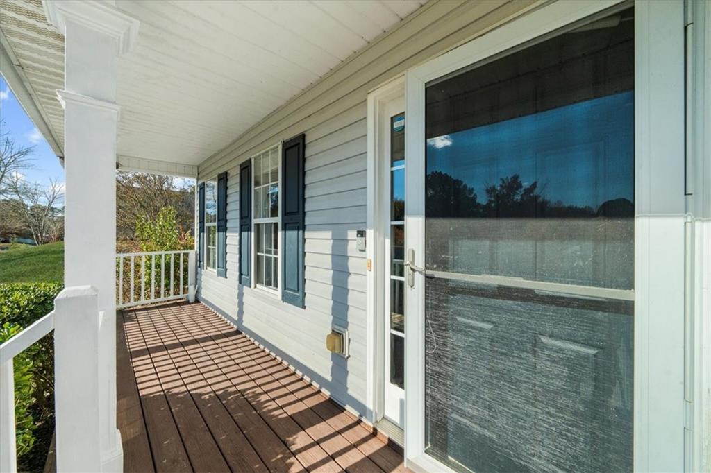 203 Bainbridge Way Dallas, GA 30132 - Photo 3 of 38 a view of a balcony with wooden floor