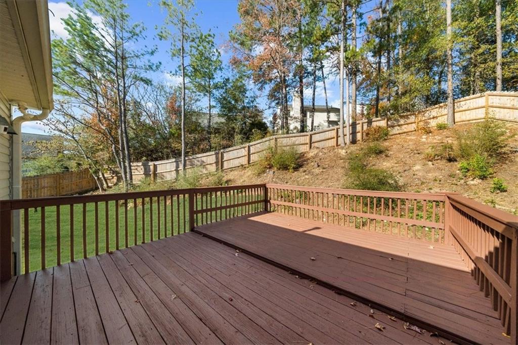 203 Bainbridge Way Dallas, GA 30132 - Photo 32 of 38 a view of a balcony with wooden floor and fence